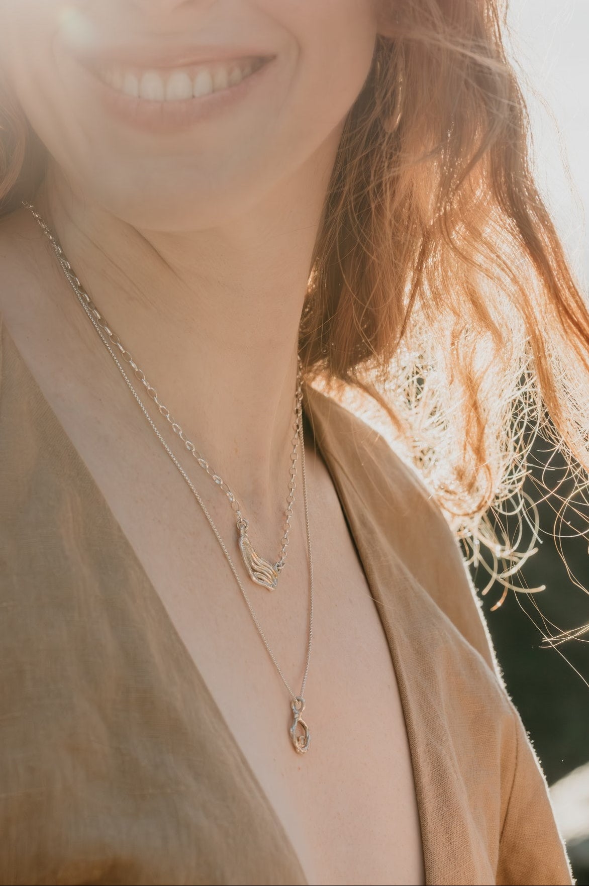 Woman wearing a necklace with a blurred background